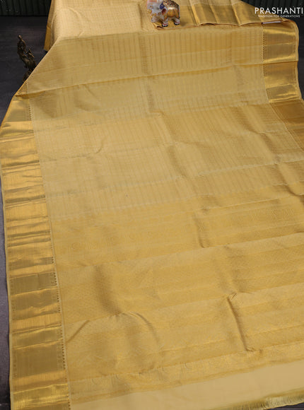 Pure kanchipuram silk saree pale yellow with allover small zari checks & buttas and rich zari woven border