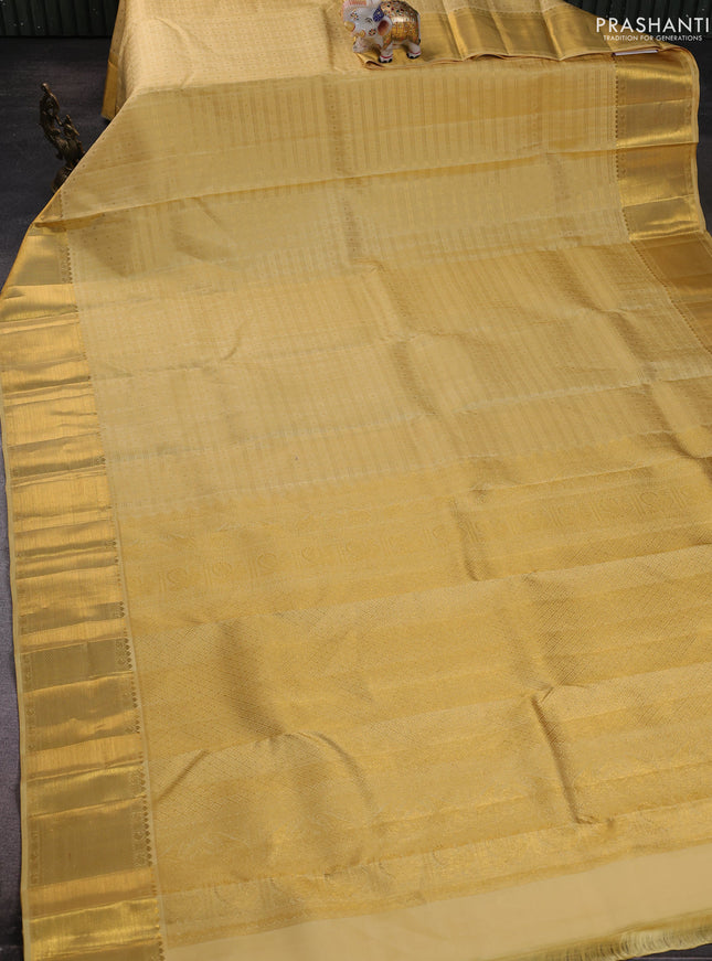 Pure kanchipuram silk saree pale yellow with allover small zari checks & buttas and rich zari woven border