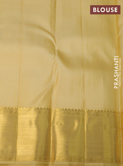 Pure kanchipuram silk saree pale yellow with allover small zari checks & buttas and rich zari woven border