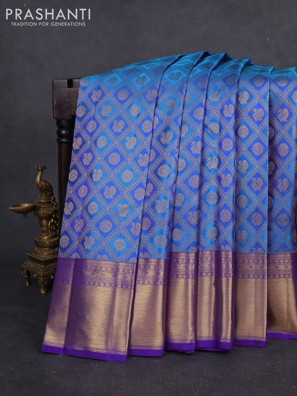 Pure kanchipuram silk saree cs blue and blue with allover zari woven mayil chakram brocade weaves and rich zari woven border