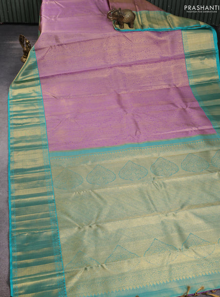 Pure kanchipuram silk saree mild lavender and teal green with allover zari woven brocade weaves and rich zari woven border