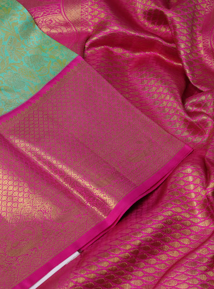Pure kanchipuram silk saree teal and pink with allover zari woven gandaberunda design and long rich zari woven border
