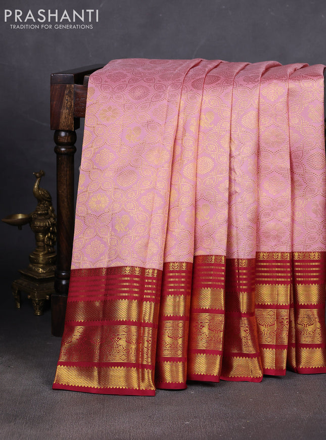 Pure kanchipuram silk saree pastel peach and maroon with allover zari woven brocade weaves and rich zari woven border