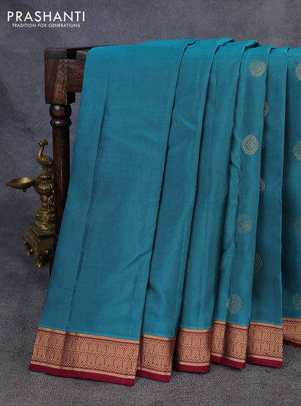 Kanchipuram silk saree peacock green and dark magenta pink with zari woven buttas and zari woven border