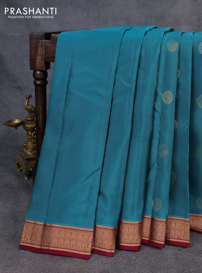 Kanchipuram silk saree peacock green and dark magenta pink with zari woven buttas and zari woven border
