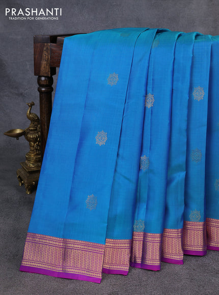 Kanchipuram silk saree dual shade of greenish blue and purple with zari woven buttas and zari woven border