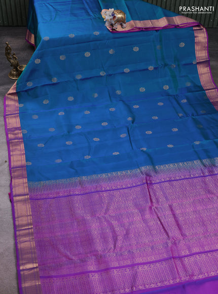 Kanchipuram silk saree dual shade of greenish blue and purple with zari woven buttas and zari woven border