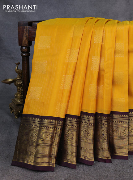 Kanchipuram silk saree yellow and wine shade with allover zari stripe & buttas and long zari woven korvai border
