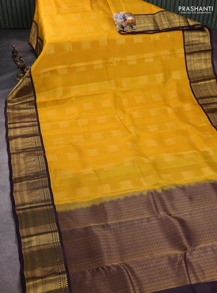 Kanchipuram silk saree yellow and wine shade with allover zari stripe & buttas and long zari woven korvai border