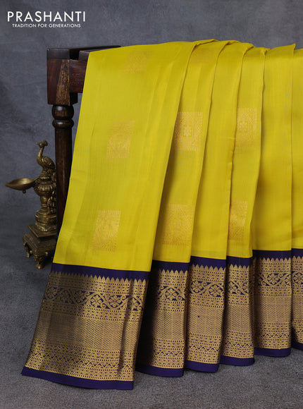 Kanchipuram silk saree yellow and navy blue with zari woven buttas and long zari woven korvai border