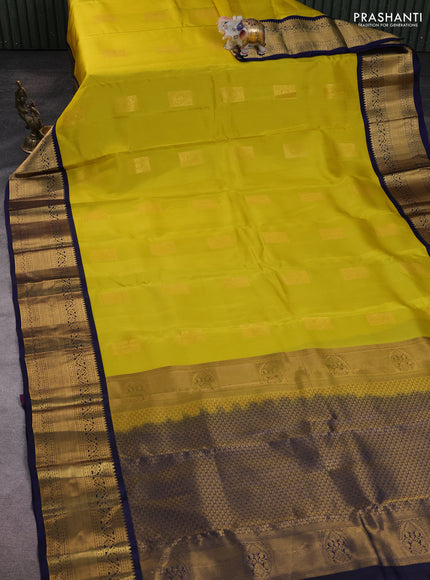 Kanchipuram silk saree yellow and navy blue with zari woven buttas and long zari woven korvai border