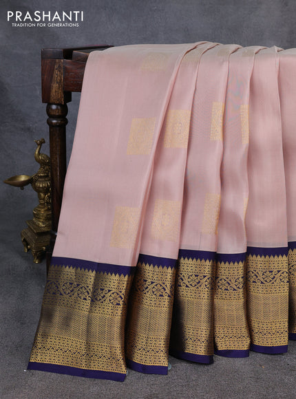 Kanchipuram silk saree pastel pink and navy blue with zari woven buttas and long zari woven korvai border