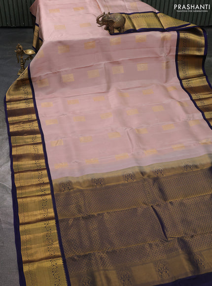 Kanchipuram silk saree pastel pink and navy blue with zari woven buttas and long zari woven korvai border