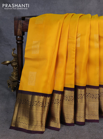 Kanchipuram silk saree yellow and deep wine with zari woven buttas and long zari woven korvai border