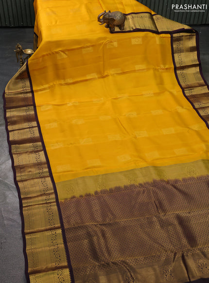Kanchipuram silk saree yellow and deep wine with zari woven buttas and long zari woven korvai border
