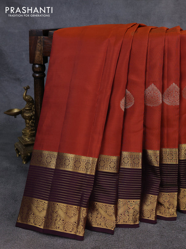 Kanchipuram silk saree rustic orange and wine shade with zari woven buttas and long zari woven border