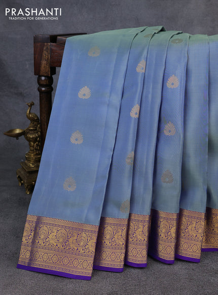 Kanchipuram silk saree bluish grey and violet with zari woven buttas and zari woven korvai border