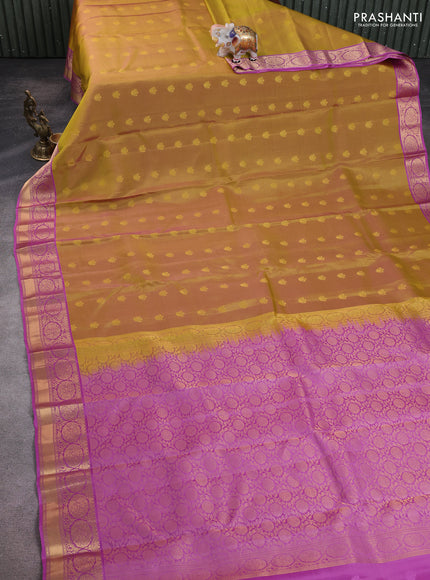 Kanchipuram silk saree mustard green and pink with allover zari woven buttas and zari woven korvai border