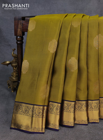 Kanchipuram silk saree dark mahendi green and navy blue with zari woven buttas and zari woven korvai border