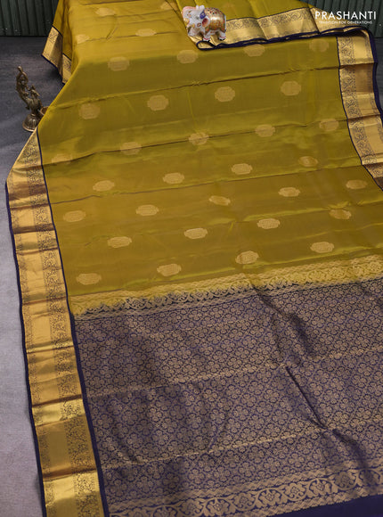 Kanchipuram silk saree dark mahendi green and navy blue with zari woven buttas and zari woven korvai border