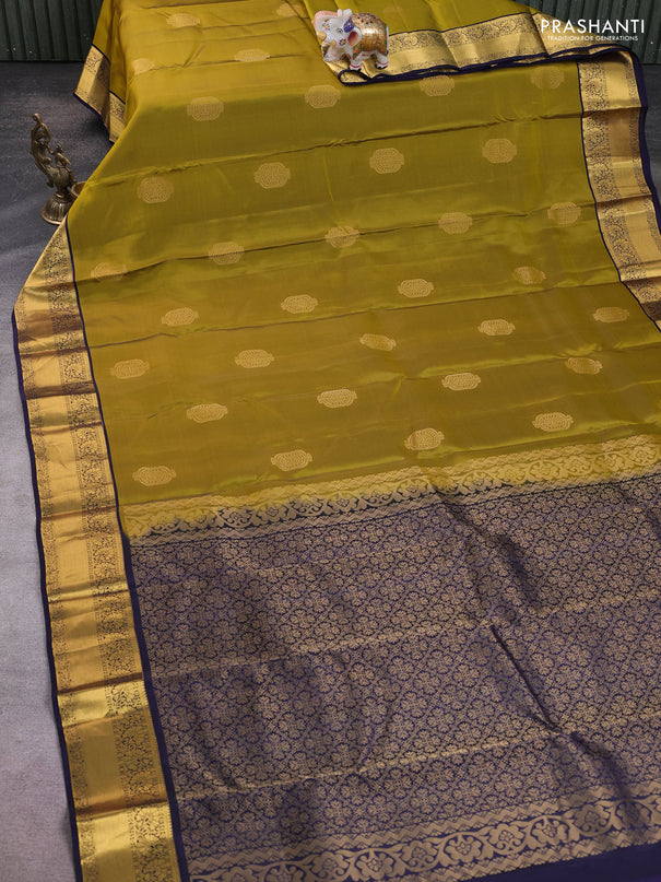 Kanchipuram silk saree dark mahendi green and navy blue with zari woven buttas and zari woven korvai border