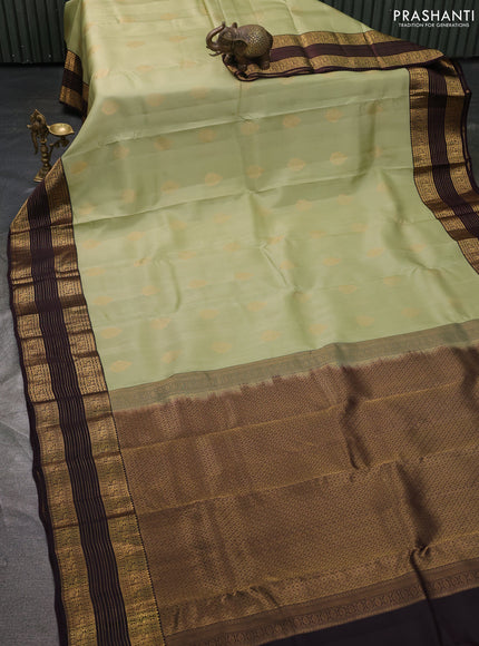 Kanchipuram silk saree pista green and coffee brown with allover zari woven buttas and long zari woven border