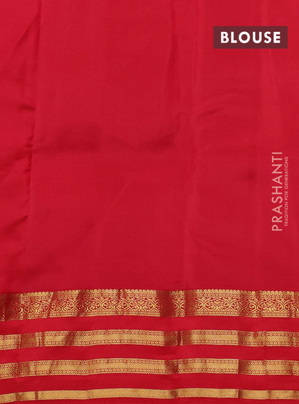 Kanchipuram silk saree green and red with allover zari woven buttas and long zari woven border