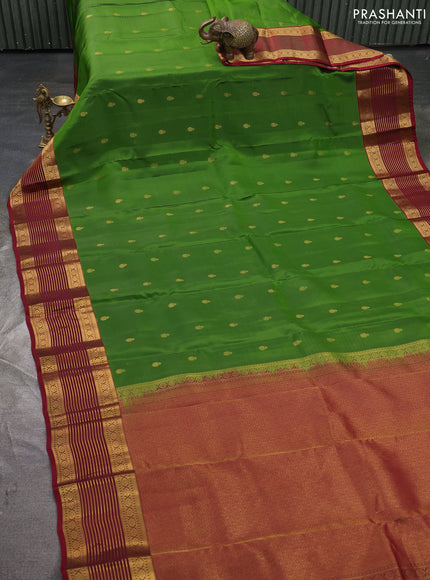 Kanchipuram silk saree green and maroon with allover zari woven buttas and zari woven korvai border