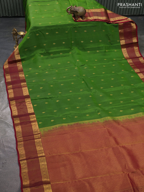 Kanchipuram silk saree green and maroon with allover zari woven buttas and zari woven korvai border