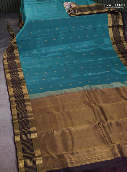 Kanchipuram silk saree peacock green shade and coffee brown with allover zari woven buttas and zari woven korvai border