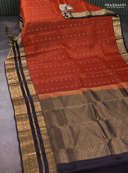 Kanchipuram silk saree rustic orange and black with allover zari woven buttas and long zari woven border