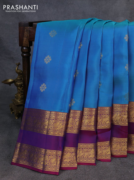 Kanchipuram silk saree dual shade of bluish green and magenta pink with zari woven buttas and rettapet zari woven border