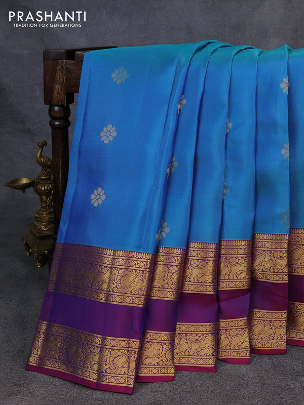 Kanchipuram silk saree dual shade of bluish green and magenta pink with zari woven buttas and rettapet zari woven border