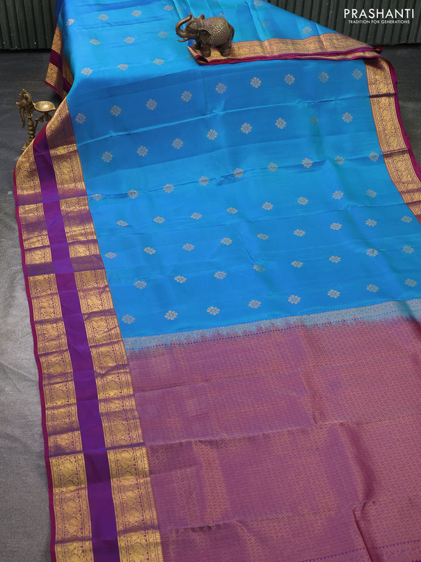 Kanchipuram silk saree dual shade of bluish green and magenta pink with zari woven buttas and rettapet zari woven border