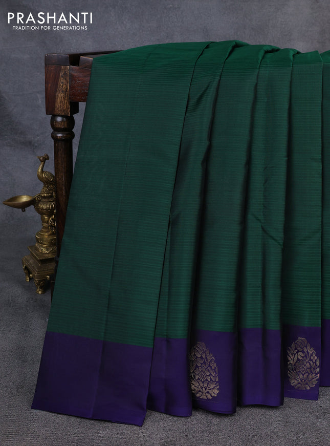 Kanchipuram silk saree bottle green and navy blue with plain body and zari woven butta border