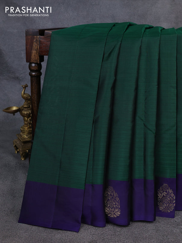 Kanchipuram silk saree bottle green and navy blue with plain body and zari woven butta border