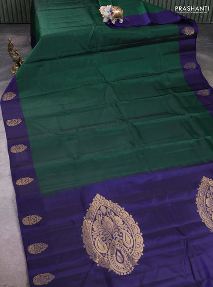 Kanchipuram silk saree bottle green and navy blue with plain body and zari woven butta border