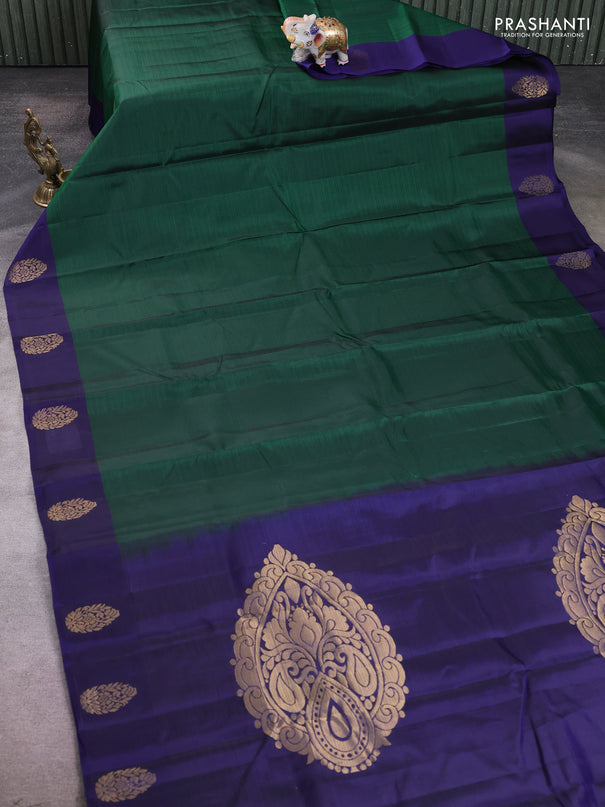 Kanchipuram silk saree bottle green and navy blue with plain body and zari woven butta border