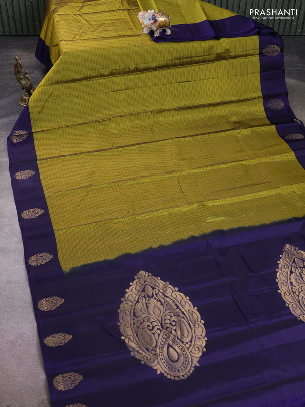 Kanchipuram silk saree mehendi green and navy blue with plain body and zari woven butta border