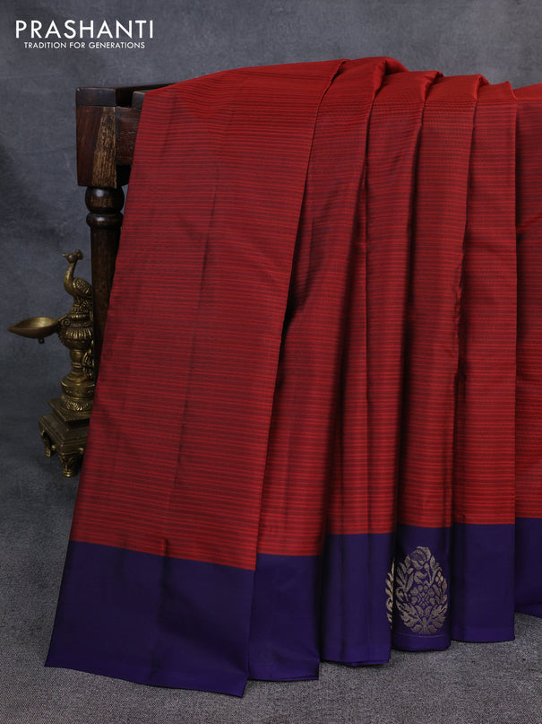 Kanchipuram silk saree maroon and navy blue with plain body and zari woven butta border