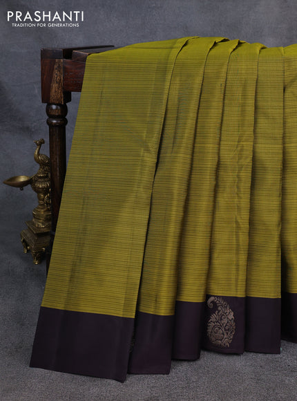 Kanchipuram silk saree mehendi green and coffee brown with plain body and paisley zari woven butta border