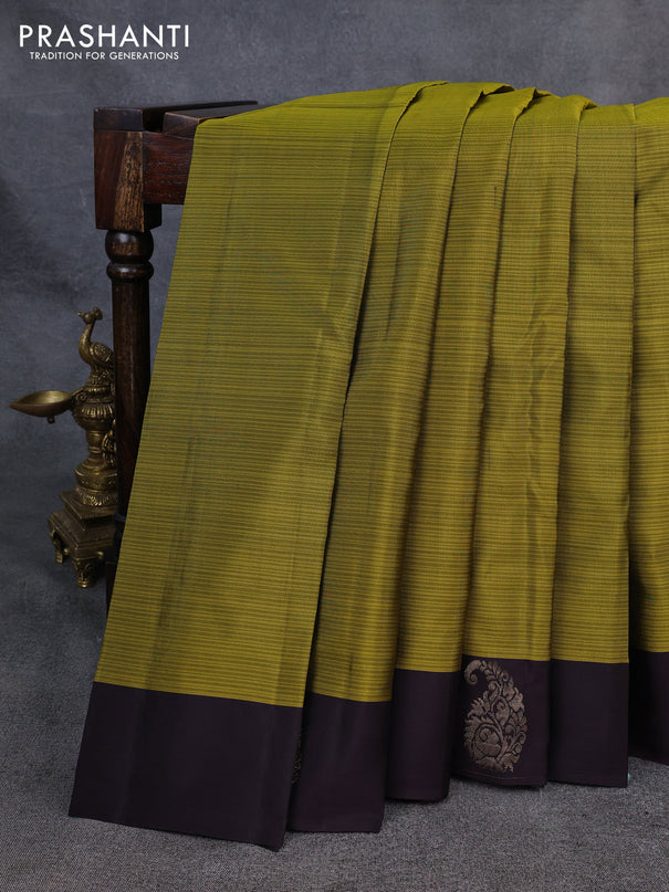 Kanchipuram silk saree mehendi green and coffee brown with plain body and paisley zari woven butta border