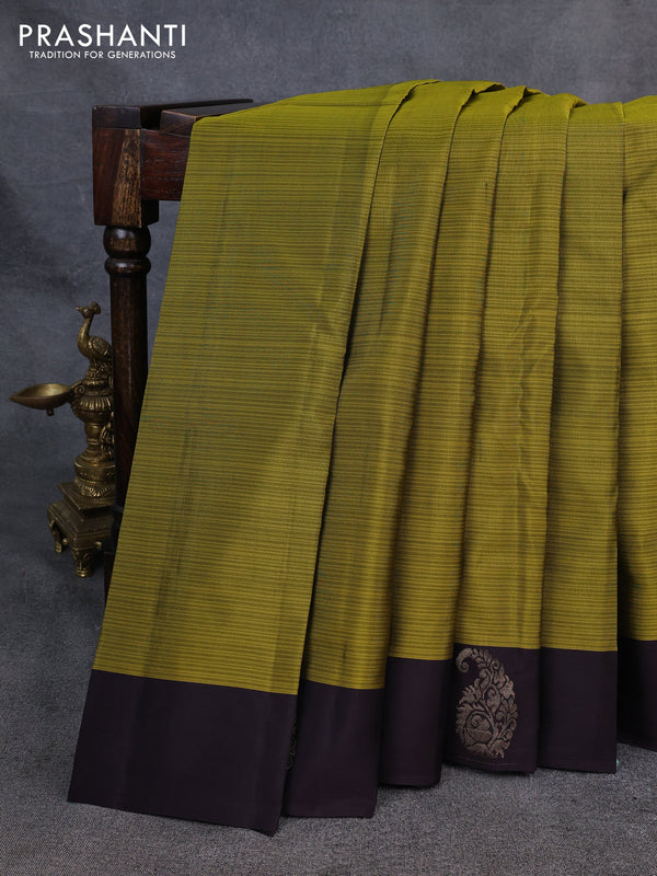 Kanchipuram silk saree mehendi green and coffee brown with plain body and paisley zari woven butta border