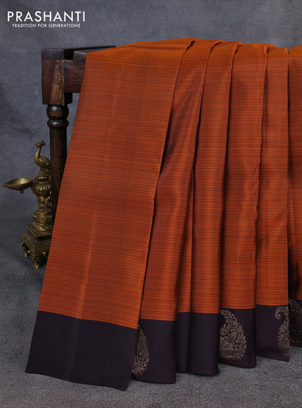 Kanchipuram silk saree rustic orange and coffee brown with plain body and paisley zari woven butta border