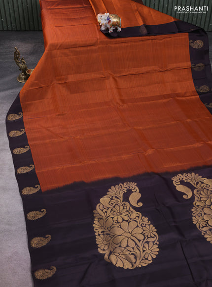 Kanchipuram silk saree rustic orange and coffee brown with plain body and paisley zari woven butta border