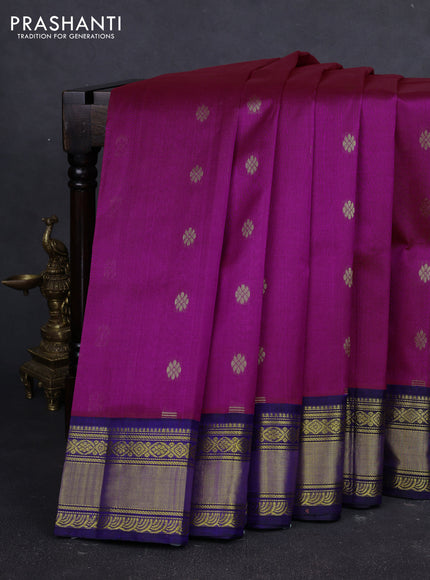 Kuppadam silk cotton saree dual shade of bluish pink and navy blue with allover zari woven buttas and zari woven korvai border