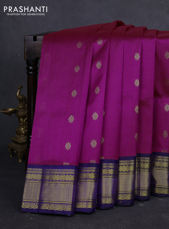 Kuppadam silk cotton saree dual shade of bluish pink and navy blue with allover zari woven buttas and zari woven korvai border
