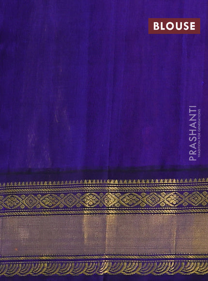 Kuppadam silk cotton saree dual shade of bluish pink and navy blue with allover zari woven buttas and zari woven korvai border