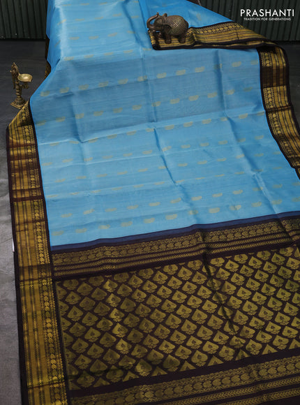 Kuppadam silk cotton saree blue shade and coffee brown with allover paisley zari woven buttas and zari woven korvai border
