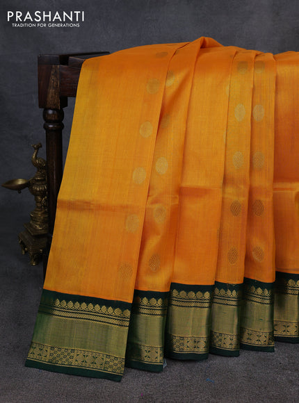 Kuppadam silk cotton saree mango yellow and bottle green with allover zari woven buttas and zari woven korvai border